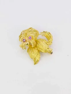Broche animalière chien or jaune rubis