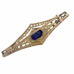 Broche Art Déco des années 1930 en or 18 kt et platine avec diamants et saphir synthétique