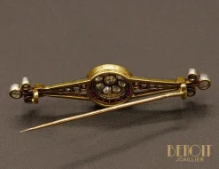 Broche Art Déco diamants rubis