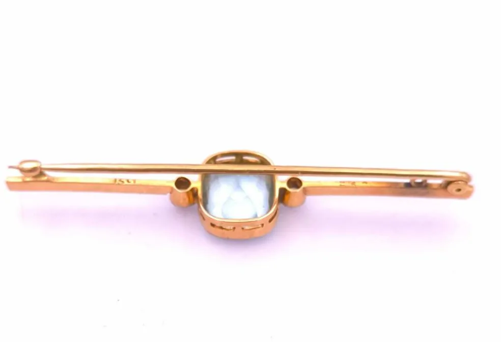 Broche Art Déco en or ornée d'une belle aigue marine et de diamants