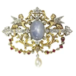 Broche avec deux sphinges diamant, saphir