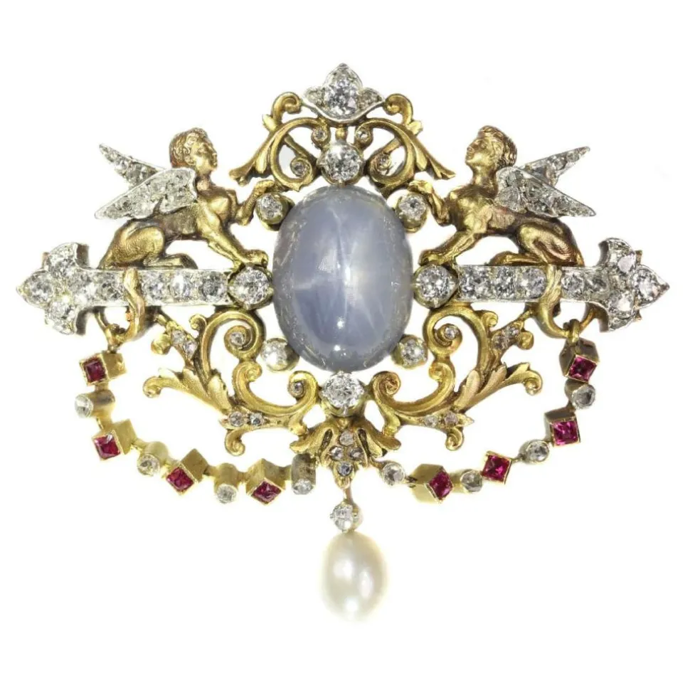 Broche avec deux sphinges diamant, saphir