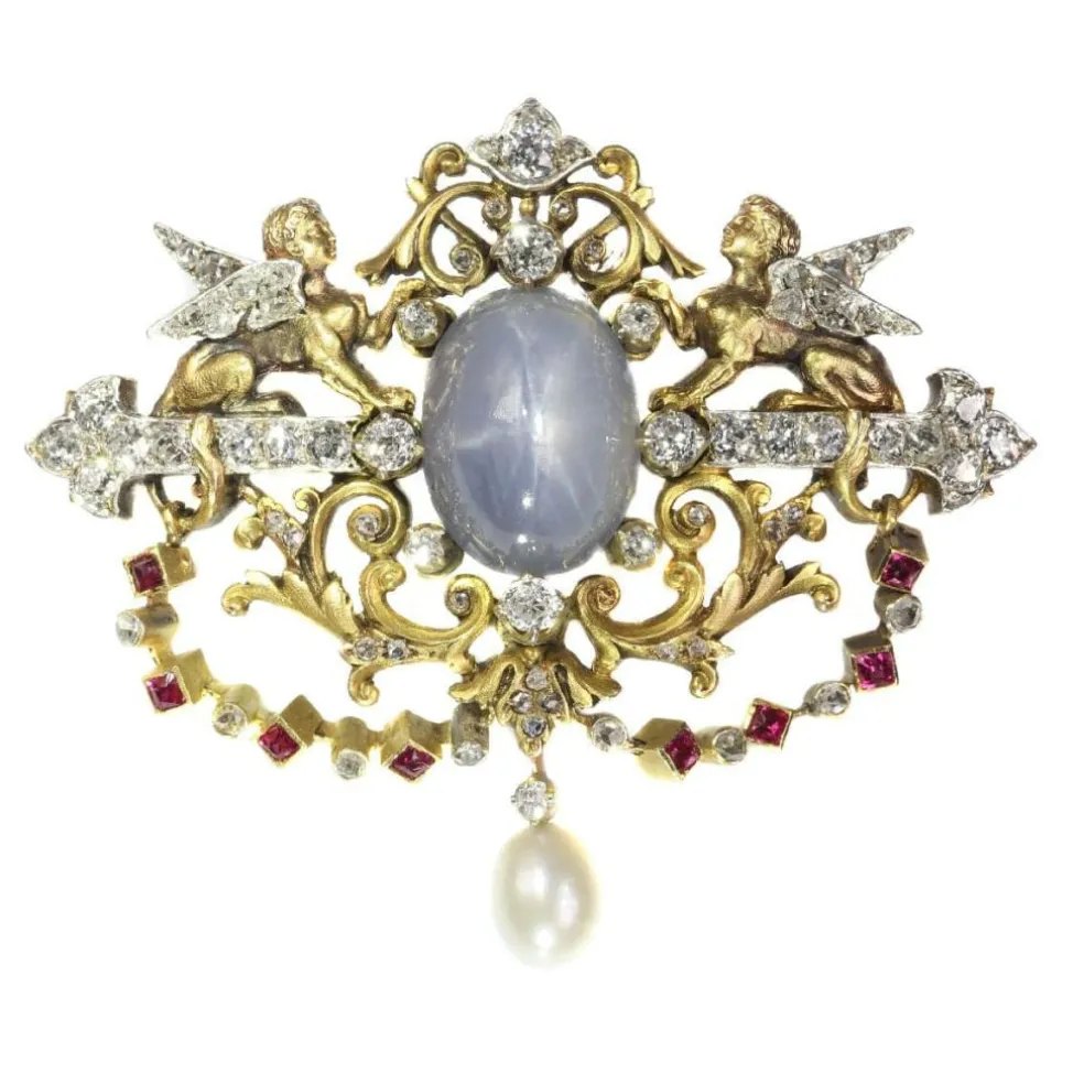 Broche avec deux sphinges diamant, saphir