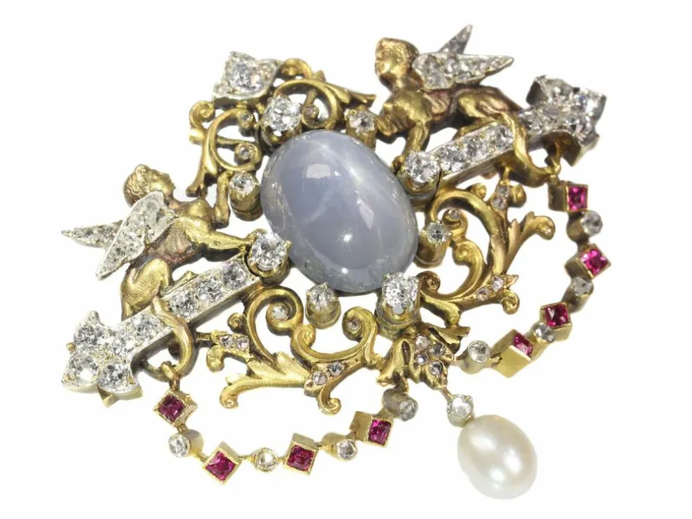 Broche avec deux sphinges diamant, saphir