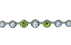 Broche barette en or 18 carats et platine en perles et peridots