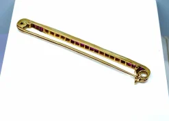 Broche barette en or 18 carats, 15 rubis , 10 diamants