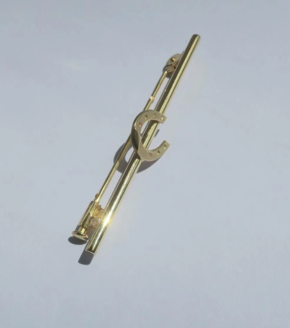 Broche barrette fer à cheval en or jaune