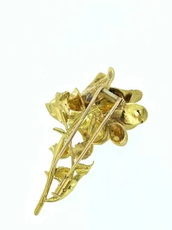 Broche en forme de rose en or jaune et blanc avec diamants