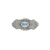 Broche en or blanc avec huit-huit diamants et aigue-marine