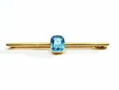 Broche en or et pierre synthétique