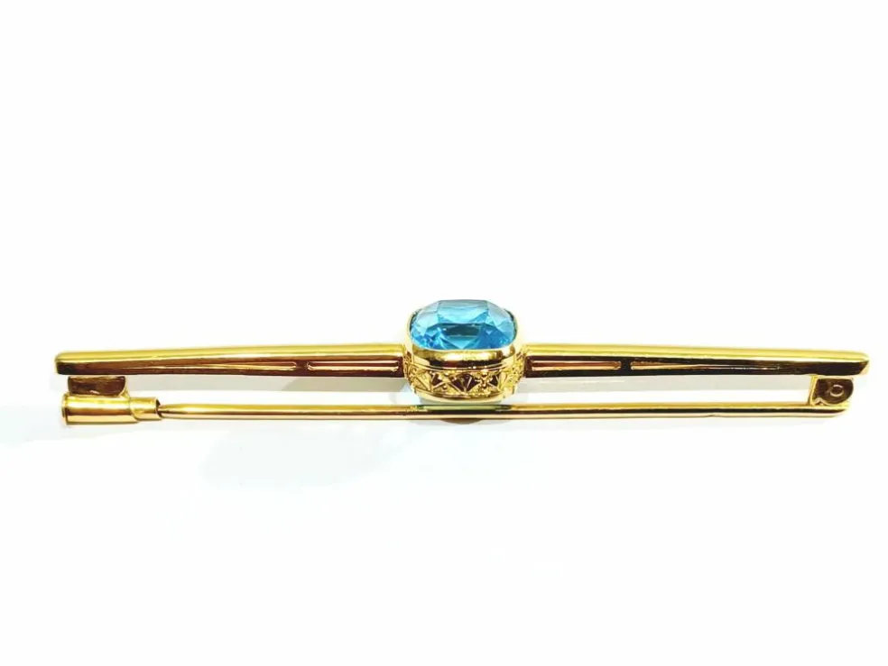 Broche en or et pierre synthétique