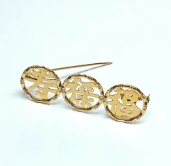 Broche en or rose idéogrammes chinois