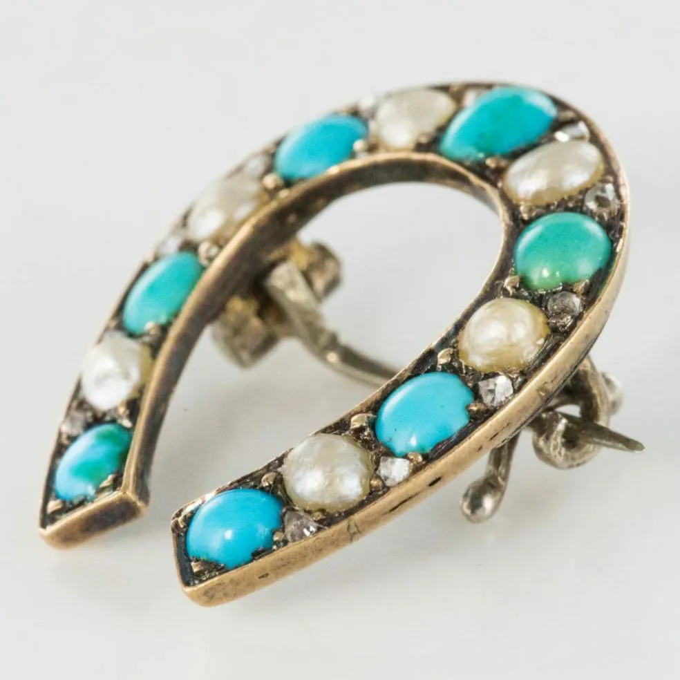 Broche fer à cheval turquoises perles fines diamants