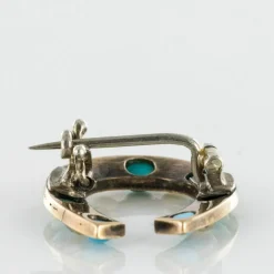 Broche fer à cheval turquoises perles fines diamants