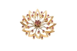 Broche fleur en or jaune avec rubis