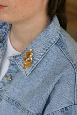 Broche noeud or rose, platine et diamants