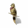 Broche oiseau en or jaune pavée de rubis.