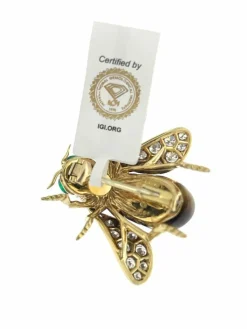 Broche or jaune et pierres précieuses signé René Kreiss