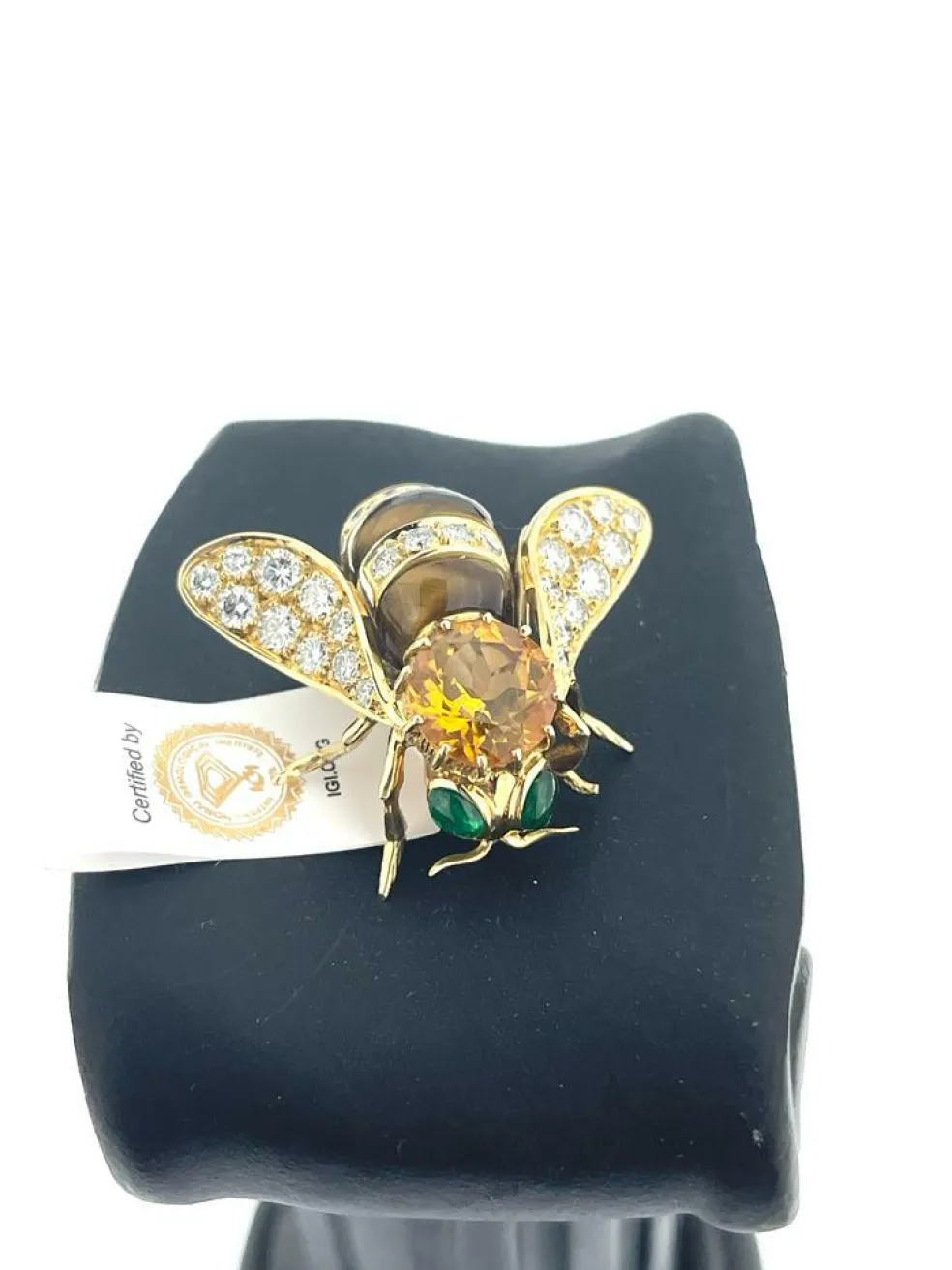 Broche or jaune et pierres précieuses signé René Kreiss