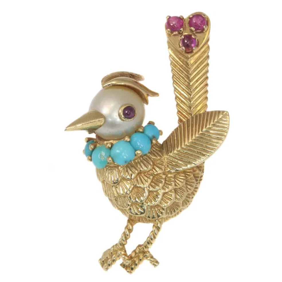 Broche ornée de bijoux