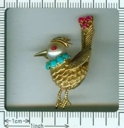 Broche ornée de bijoux