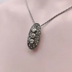 broche ou pendentif ovale en argent et diamant avec dos en or