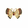 Broche Papillon or jaune, saphirs, rubis