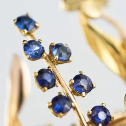 Broche rétro bouquet or et pierres précieuses