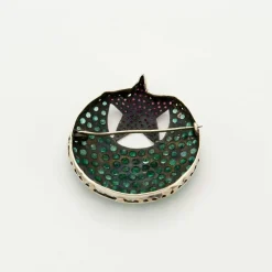 Broche rubis émeraudes