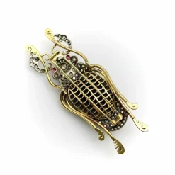 Broche scarabée édouardienne en or et argent sterling avec diamants taille rose, onyx et rubis