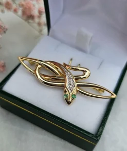 Broche serpent émeraudes