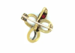 Broche Serpent or jaune, rubis, topaze