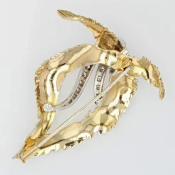 Broche vintage en or amati et diamants