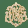 Broche volutes Art Nouveau en or jaune et diamants