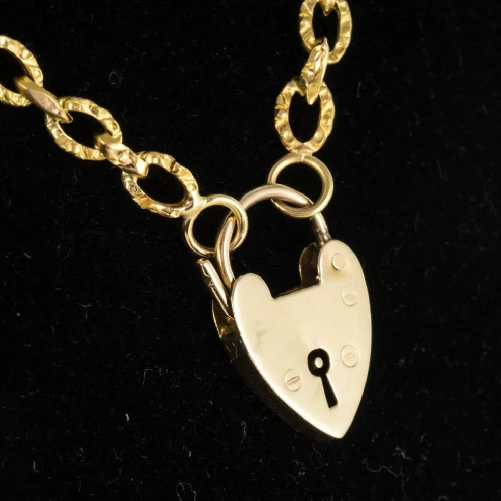 Chaine ancienne ciselée et son cadenas en forme de coeur