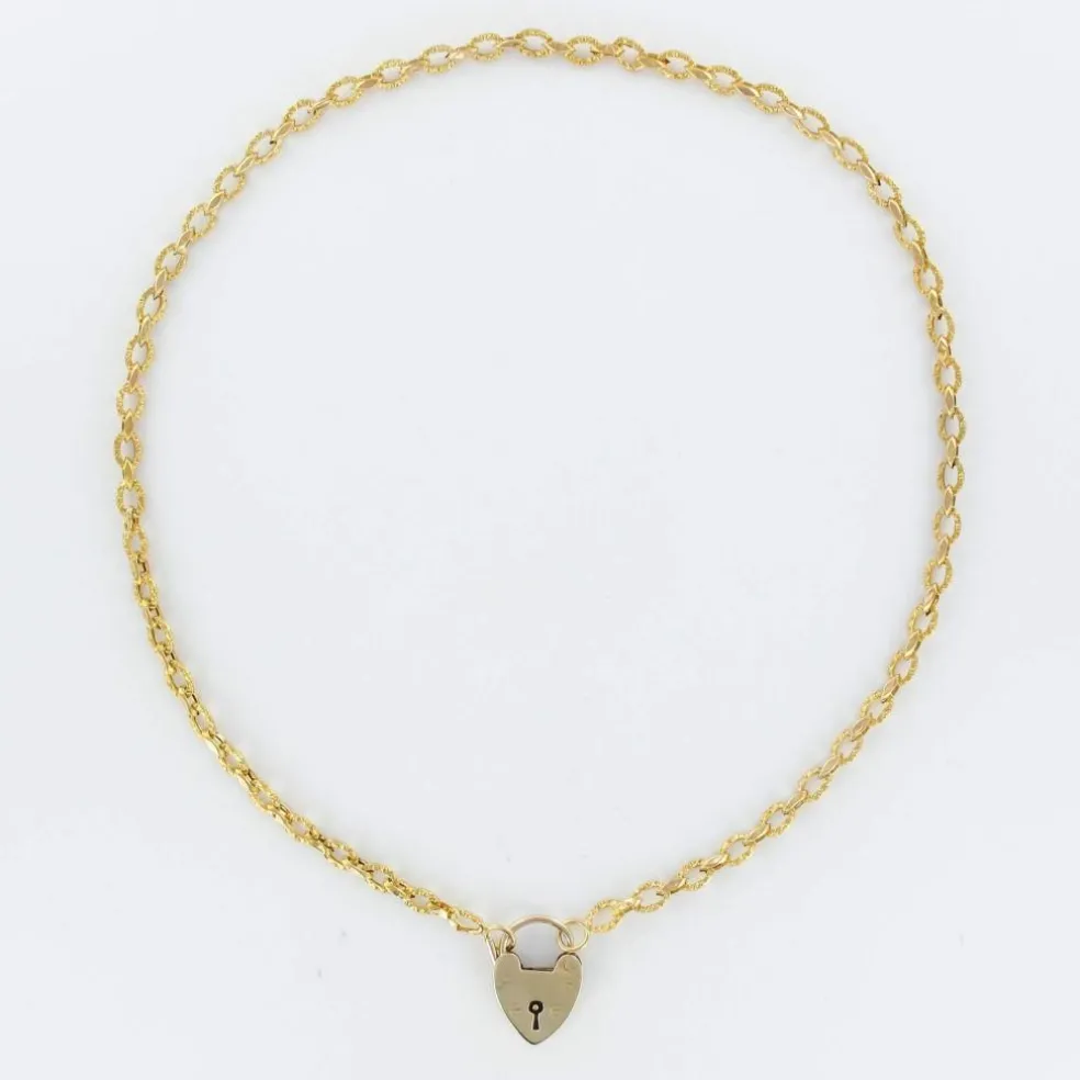 Chaine ancienne ciselée et son cadenas en forme de coeur