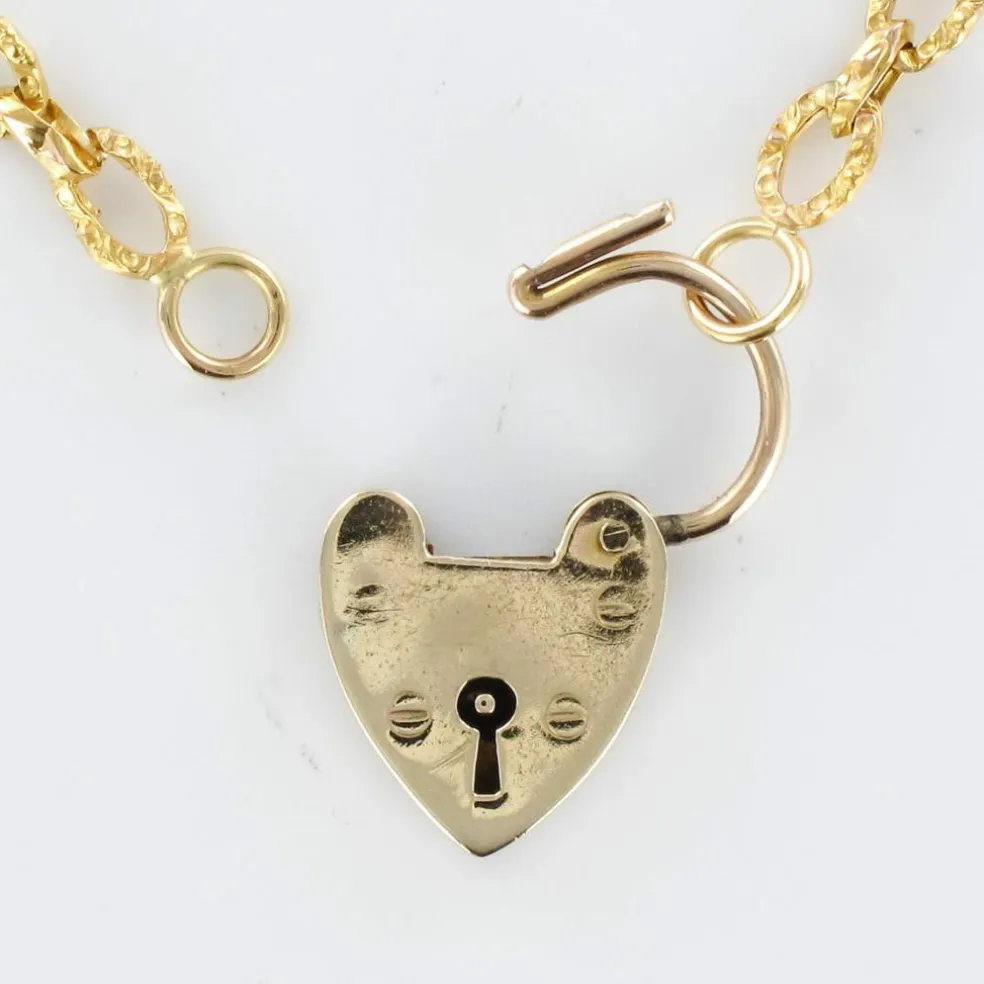 Chaine ancienne ciselée et son cadenas en forme de coeur