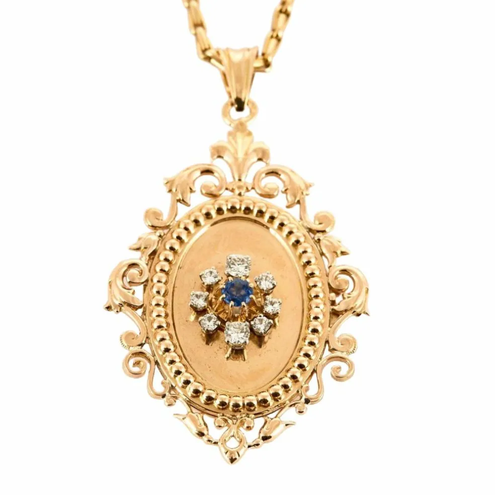 Chaîne en or jaune et pendentif porte souvenir ouvrant or , diamants et saphir