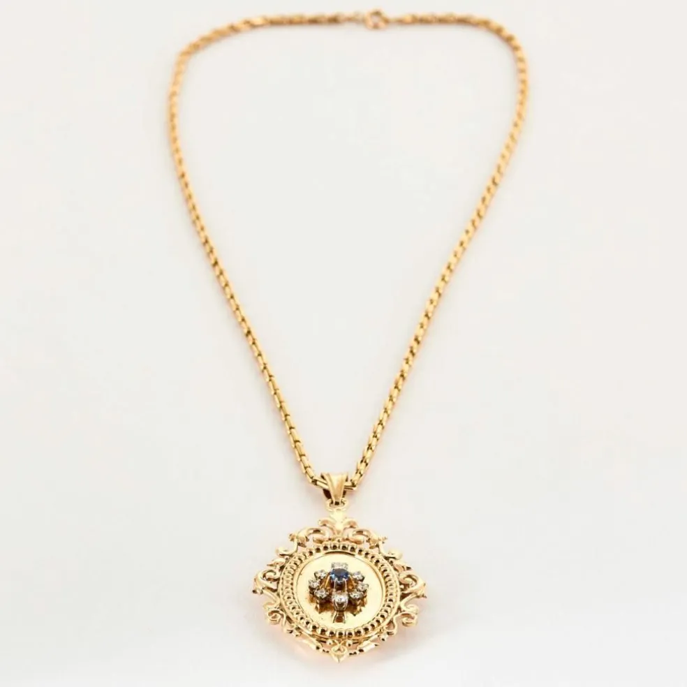 Chaîne en or jaune et pendentif porte souvenir ouvrant or , diamants et saphir
