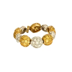 CHANTECLER - Bagues souples en or jaune et or gris, diamants et saphirs jaune