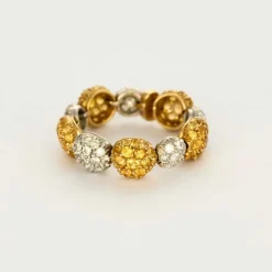 CHANTECLER - Bagues souples en or jaune et or gris, diamants et saphirs jaune