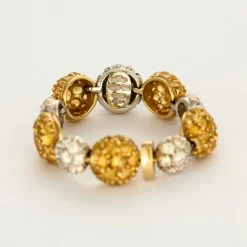 CHANTECLER - Bagues souples en or jaune et or gris, diamants et saphirs jaune