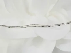 Collier en or blanc et 4 coeurs