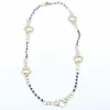 Collier en or jaune et spinelle motif floral