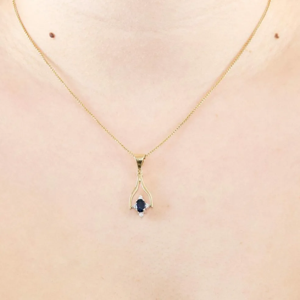 Collier en or jaune mobile avec saphirs et diamants