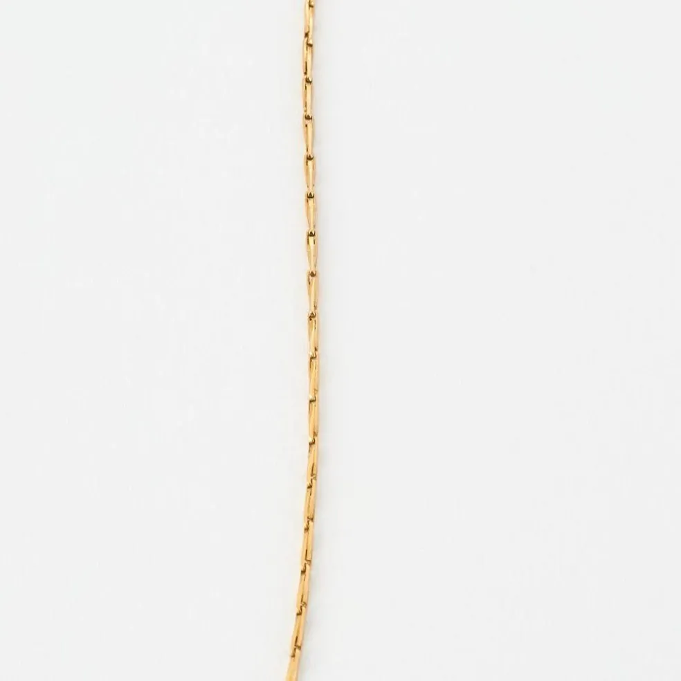 Collier en or jaune, rubis ovales facettés