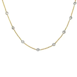 Collier gouttière en deux tons d'or serti de diamants.
