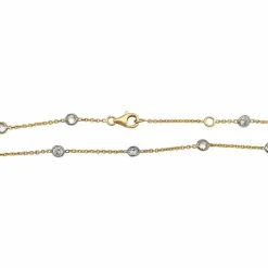 Collier gouttière en deux tons d'or serti de diamants.
