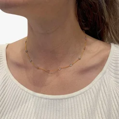 Collier gouttière en deux tons d'or serti de diamants.