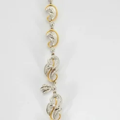 Collier guirlande or jaune et or blanc, diamants et rubis